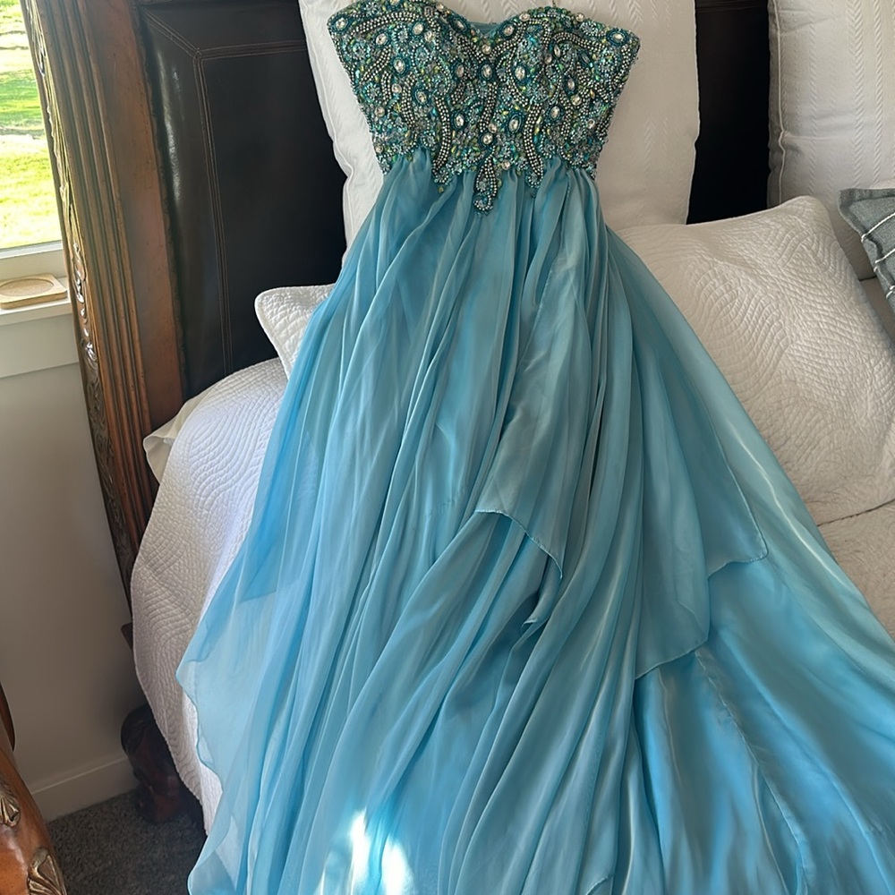 Jovani prom dress 
Elegant Blue Beaded Strapless Gown